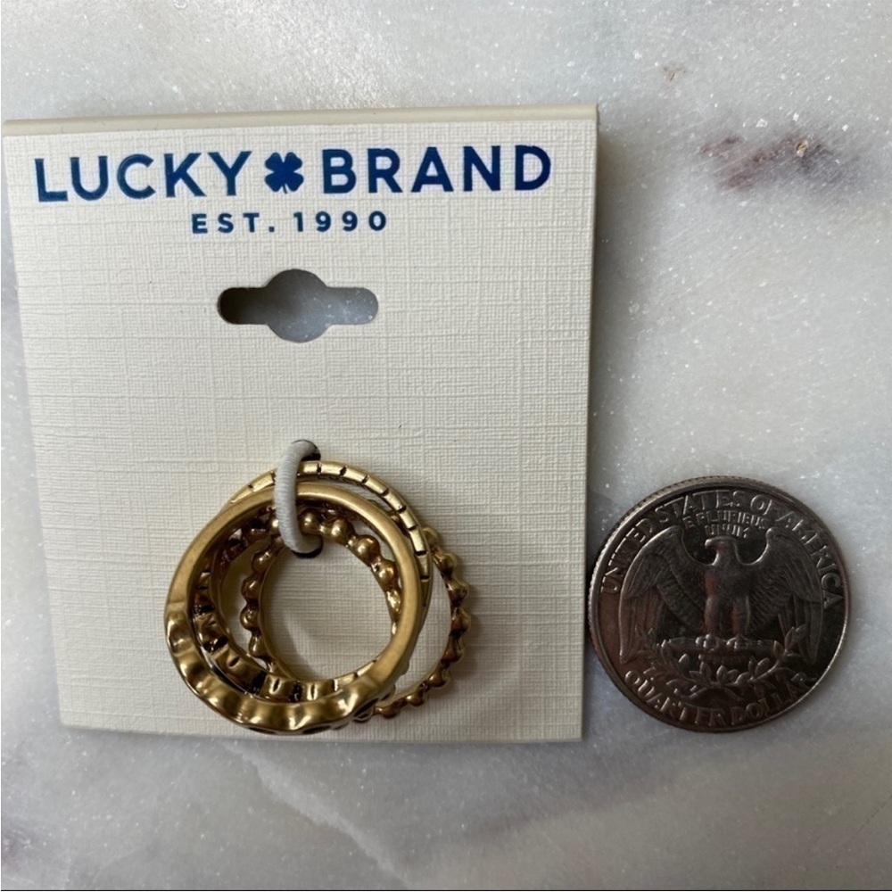 NWT LUCKY BRAND Set of 4 Gold Tone Stackable Rings Blue Stone Accent Size 7 - Picture 3 of 5